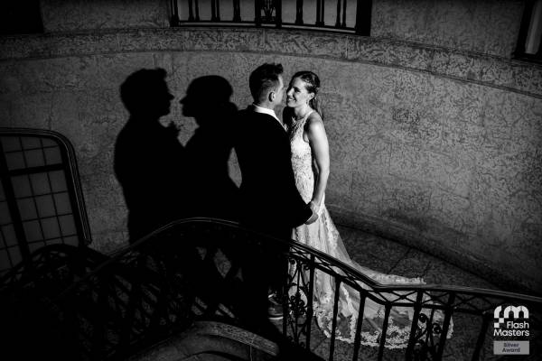 Newlyweds on the stairs in Fairmont hotel in Banff