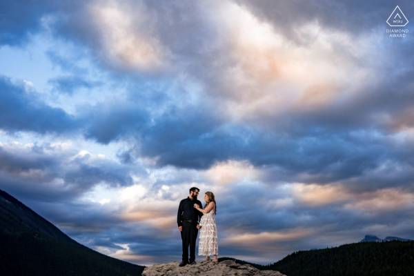 Engaged couple during stunning sunrise in Banff
