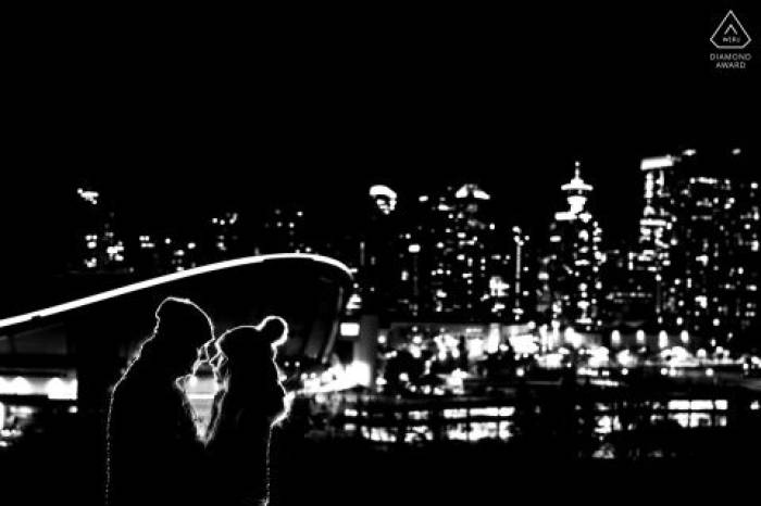 backlighted couple in love against stunning city of Calgary