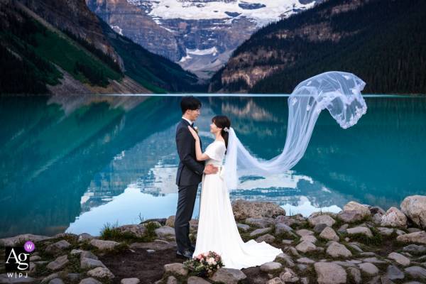 Bride and groom are looking at each other during Banff wedding session