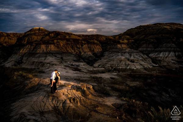 Alberta Engagement Photo at Drumheller Horseshoe Canyon of coupe dancing with passion.