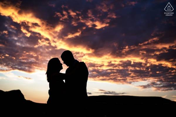 Silhouetted engaged couple during a majestic sunrise in Calgary.
