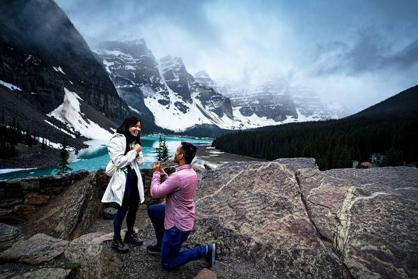 The man proposes to his girlfriend at Moraine Lake