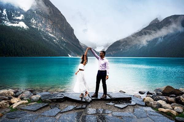 Newly engaged couple dance at Lake Louise