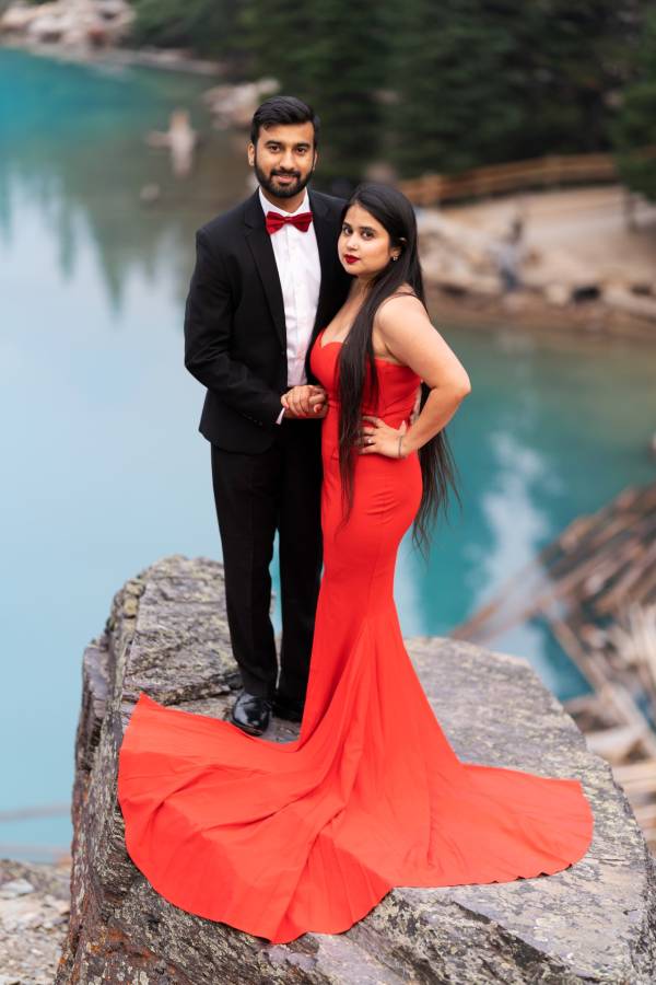 Indian couple posing during their engagement photo session at Moraine Lake.