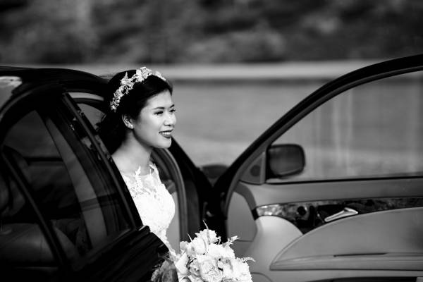 Bride stepping out from the wedding car
