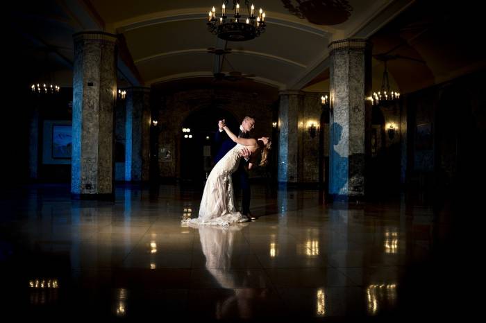 Newlyweds dance at the ball room in Fairmont Banff Springs hotel.