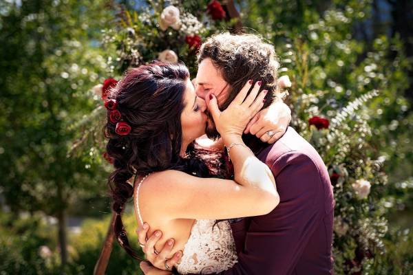 Bride and groom first kiss during Banff Wedding Ceremony.