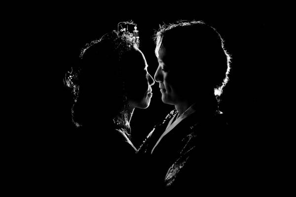 back-lighted newlyweds in black and white. Creative Photograph taken by Banff Wedding Photographer