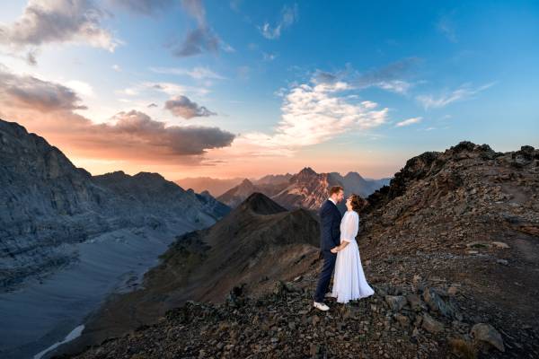 Bride and groom portrait on the top of the mountain
