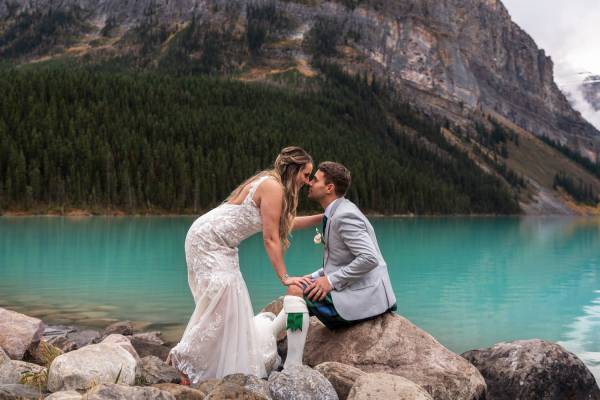 Braide kissing the groom after wedding ceremony at Lake Louise