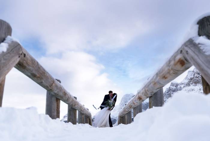 Emotional moment during newlyweds kiss in Banff National Park