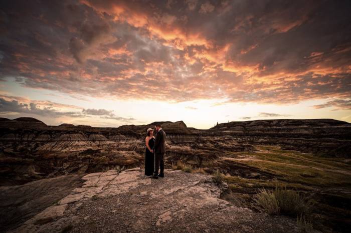Couple in love holds their hands during their after-wedding session with Calgary Wedding Photographers.
