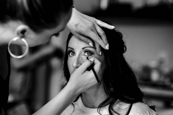 Make up artist put a make up on the bride before Banff Wedding Ceremony.