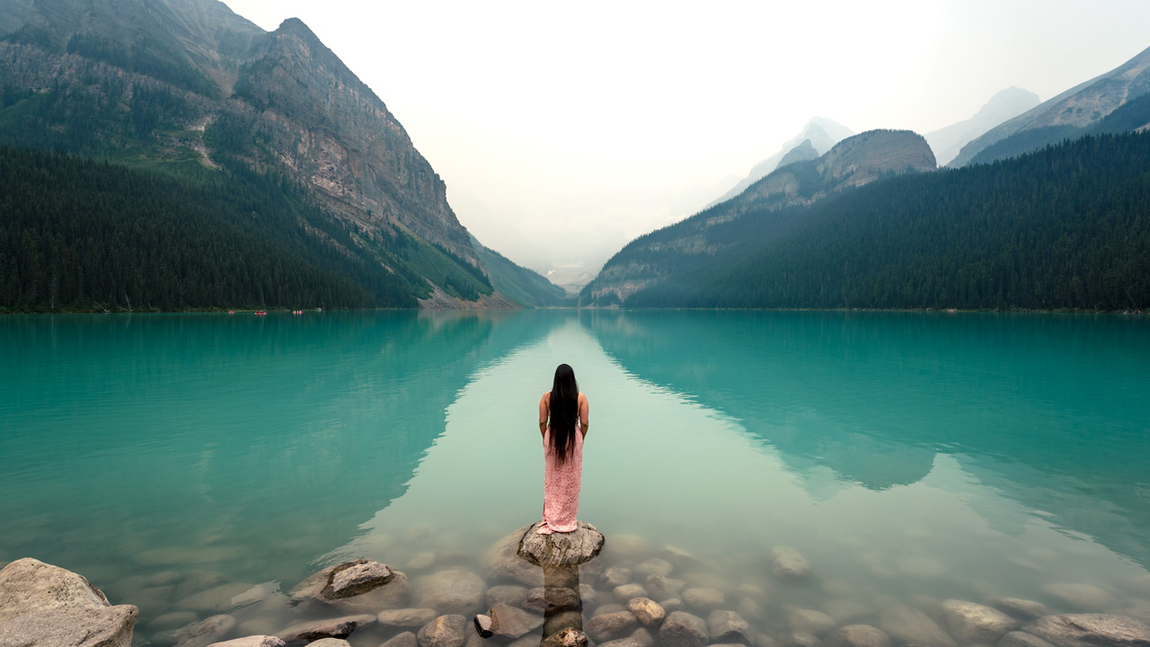Woman standing on the rock in Banff National Park | 4Eyes Photography