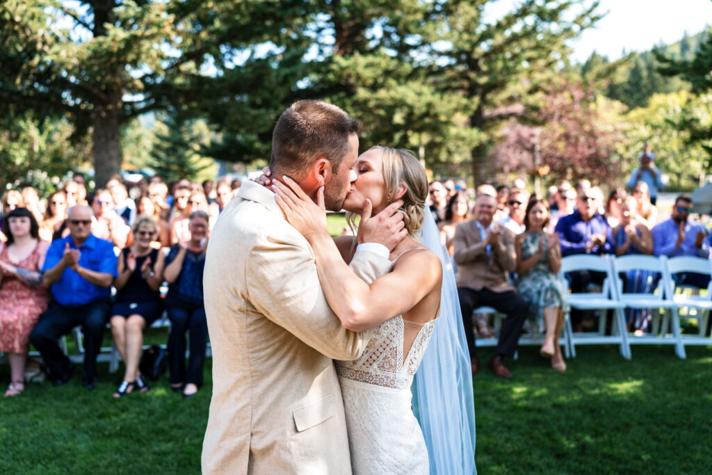 Bride and groom's first kiss after wedding ceremony | 4Eyes Photography
