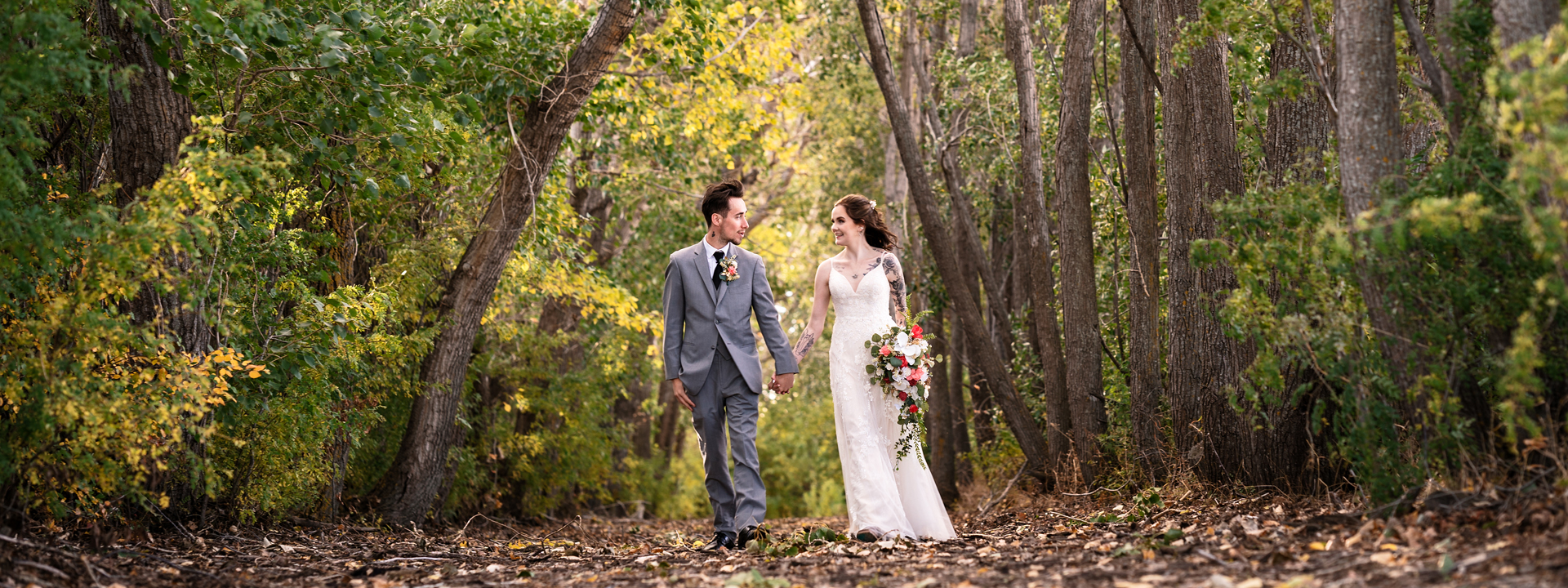 Bride and groom are walking in the woods | 4Eyes Photography