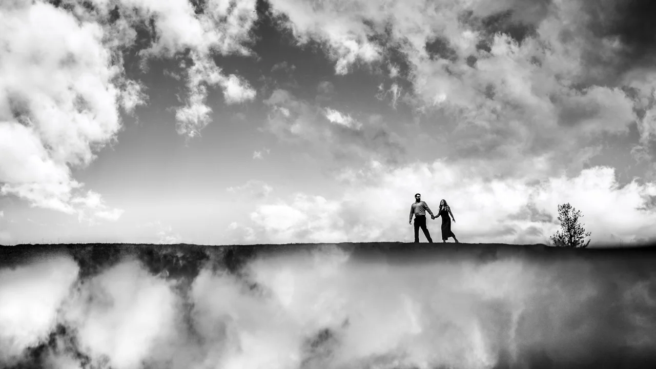 Couple hold hands during engagement session with Banff wedding photographers | 4Eyes Photography | 4Eyes Photography