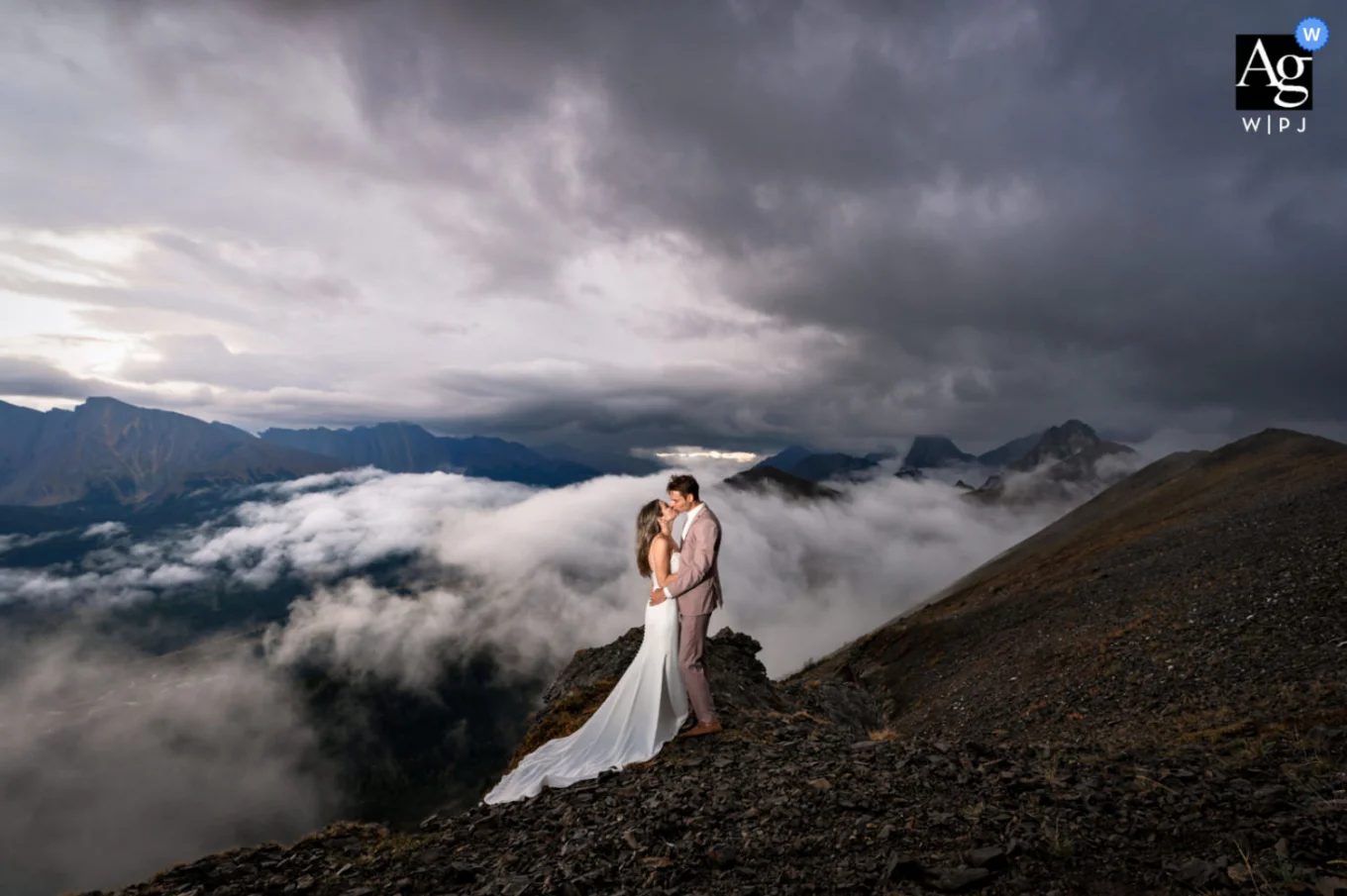 Bride and groom at the top of the mountain