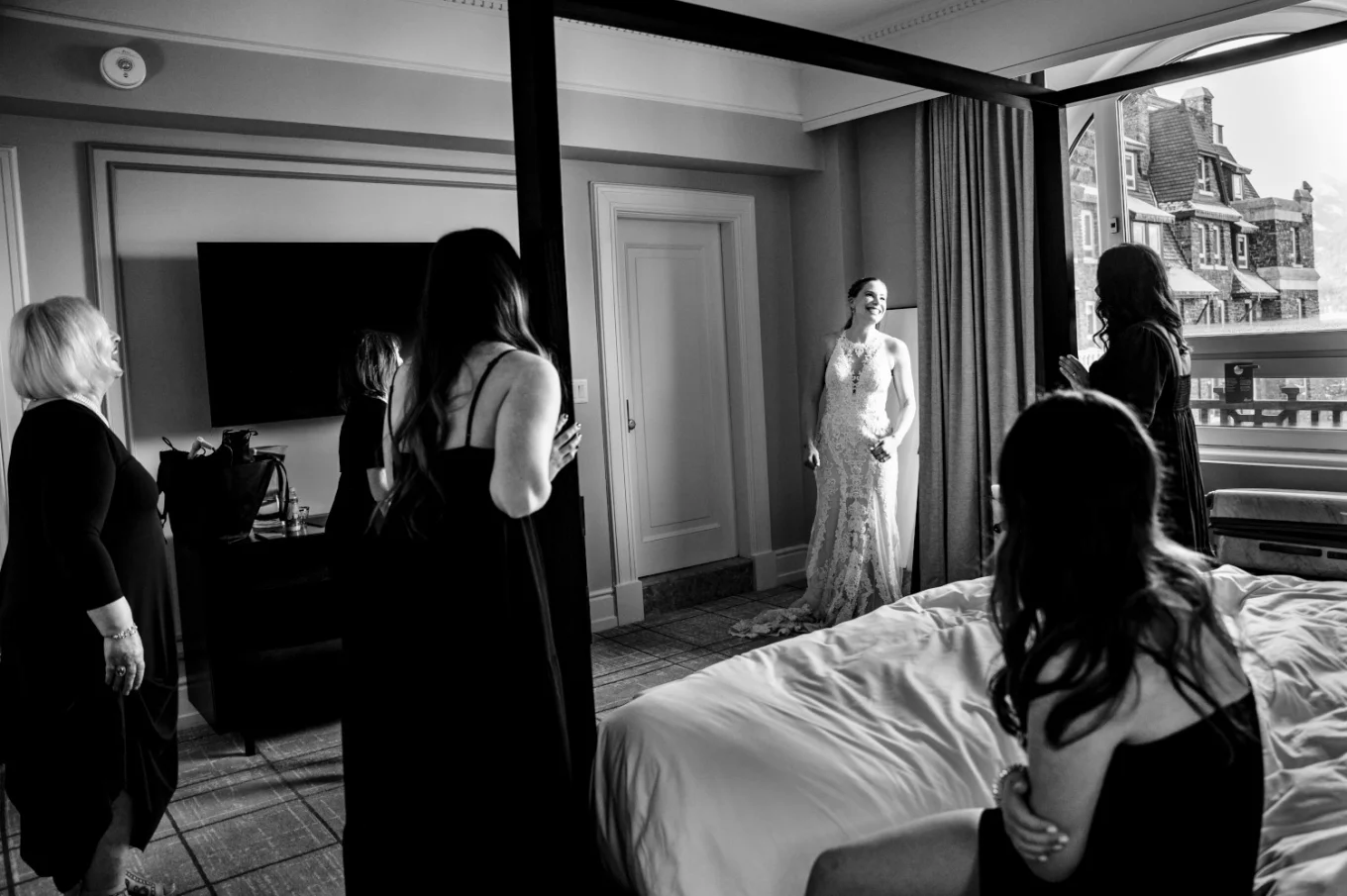 First look of the bride and bridesmaids at Fairmont Hotel room in Banff.