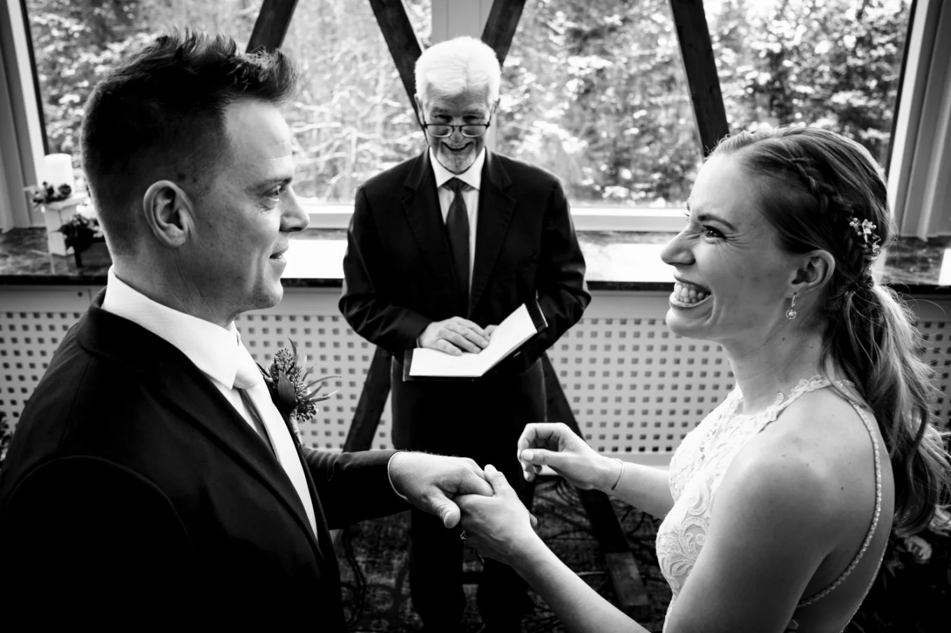 Banff Wedding Photography of the moment of exchanging wedding rings.