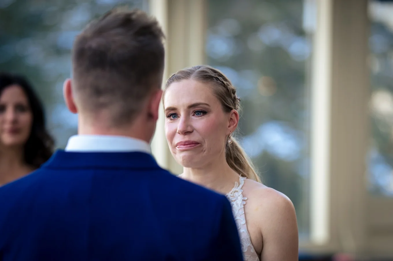 The bride cries at the Banff wedding ceremony.