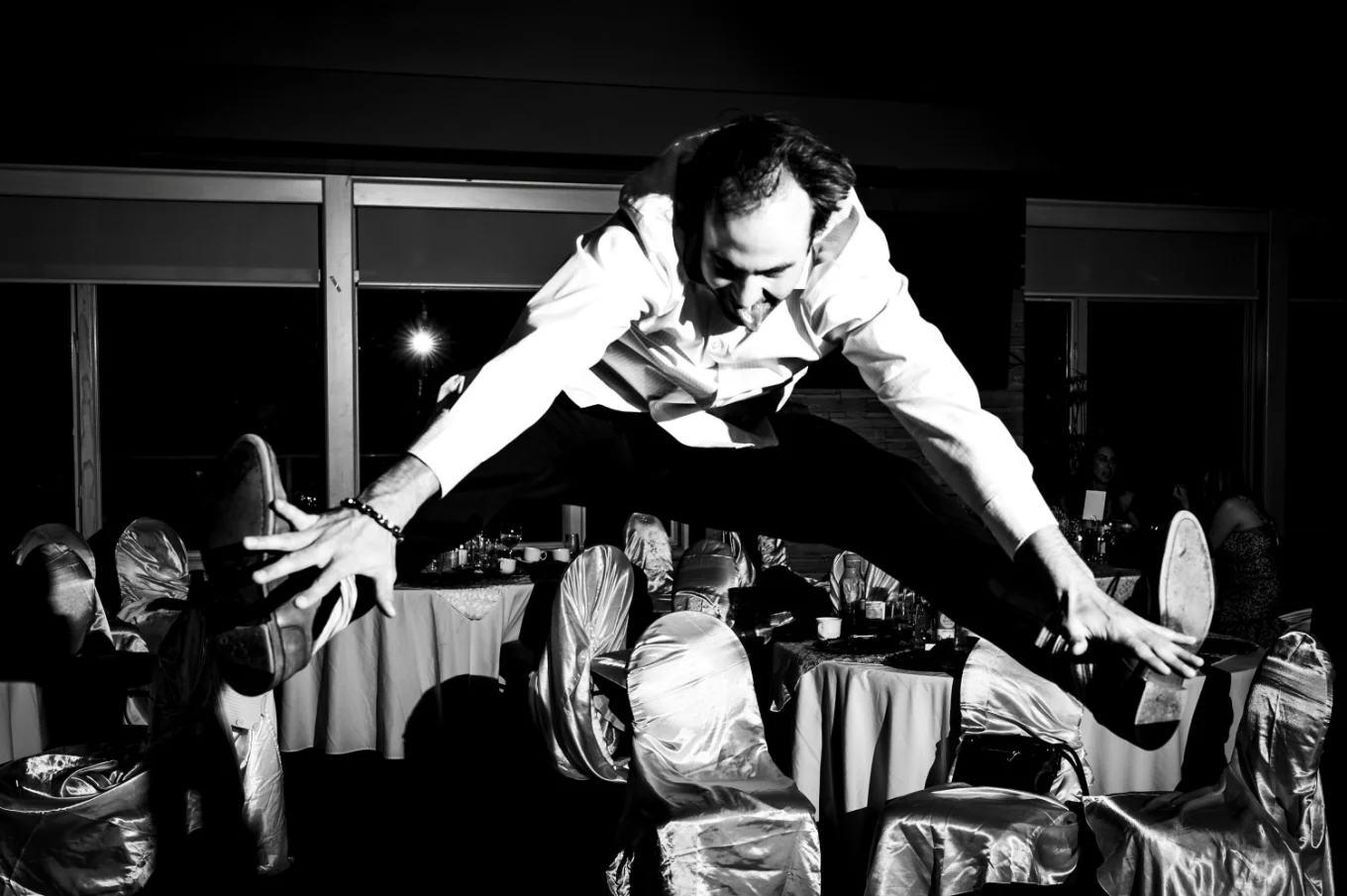 Wedding guest jumps and touches his feet on the Calgary Reception.