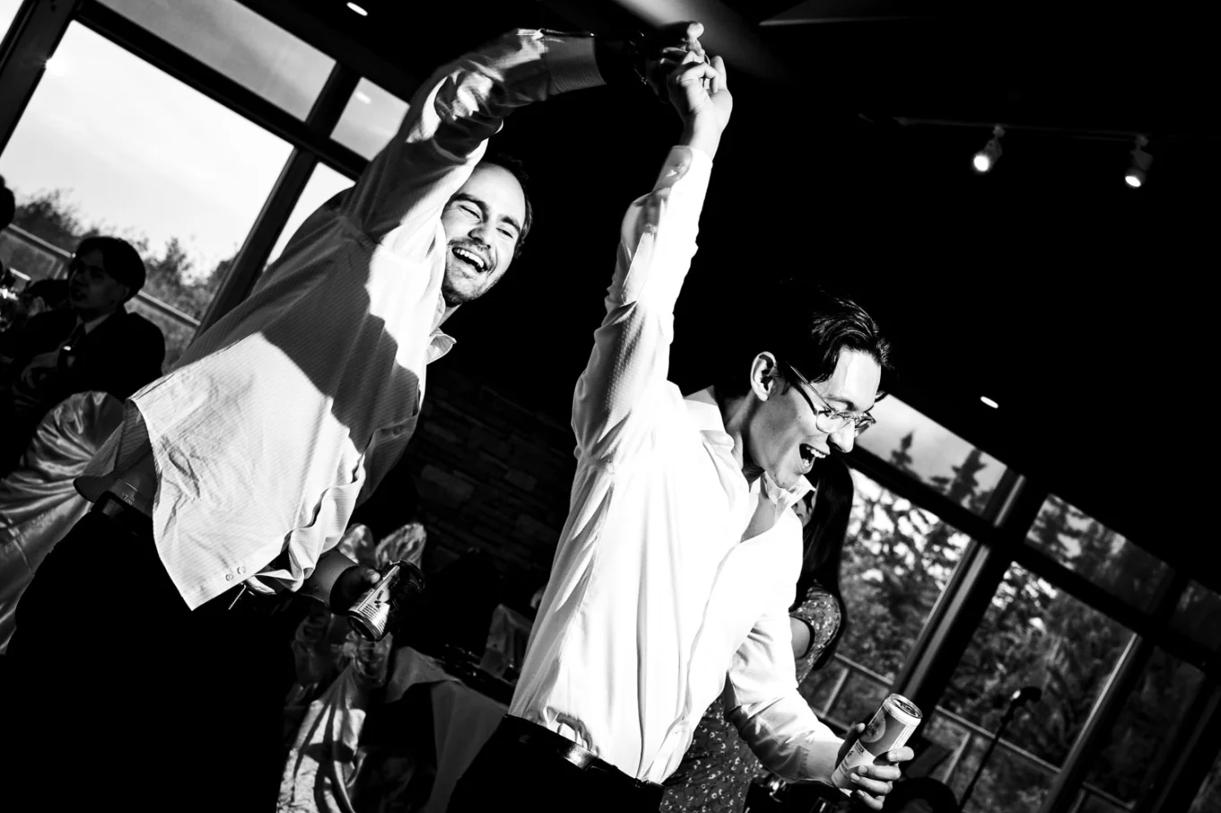 Two man dance together at the Calgary Wedding.
