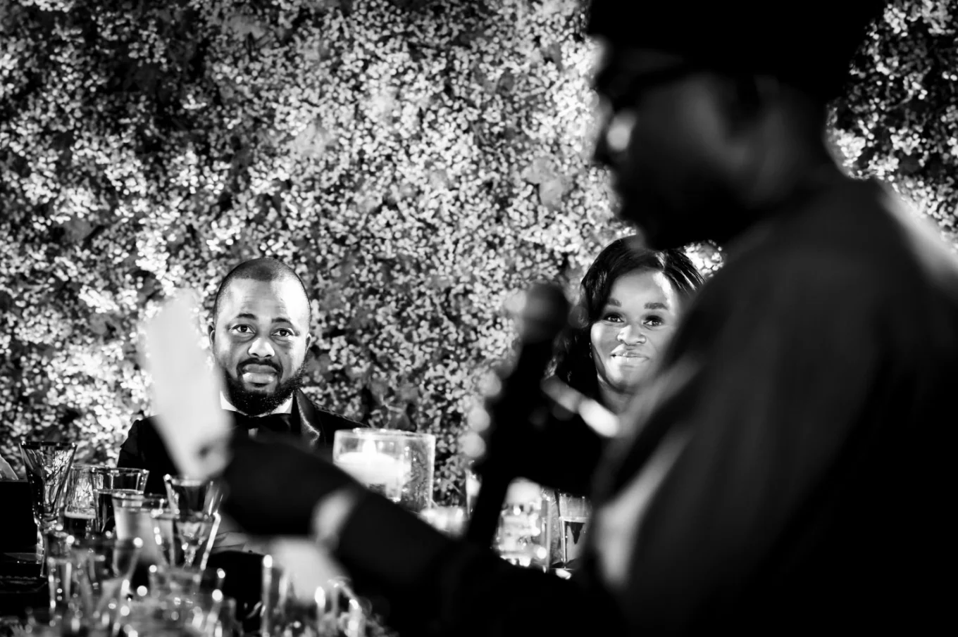 Father of the bride gives a speech on the traditional Nigerian wedding in Calgary. Fantastic shoot through the microphone and the paper on the bride and groom.