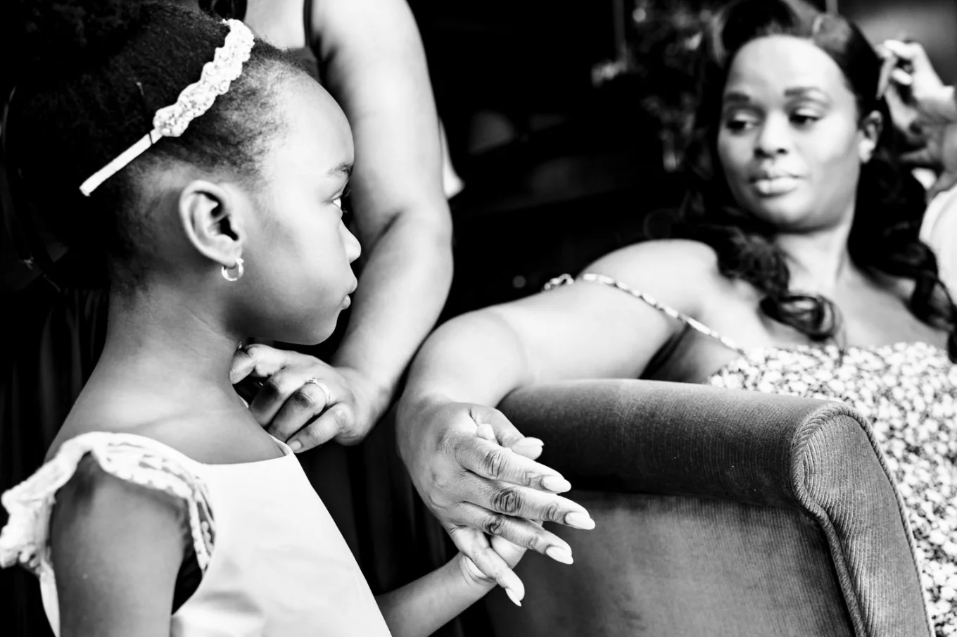 Photograph in black and white of the bride and her daughter during getting ready time before the wedding ceremony.