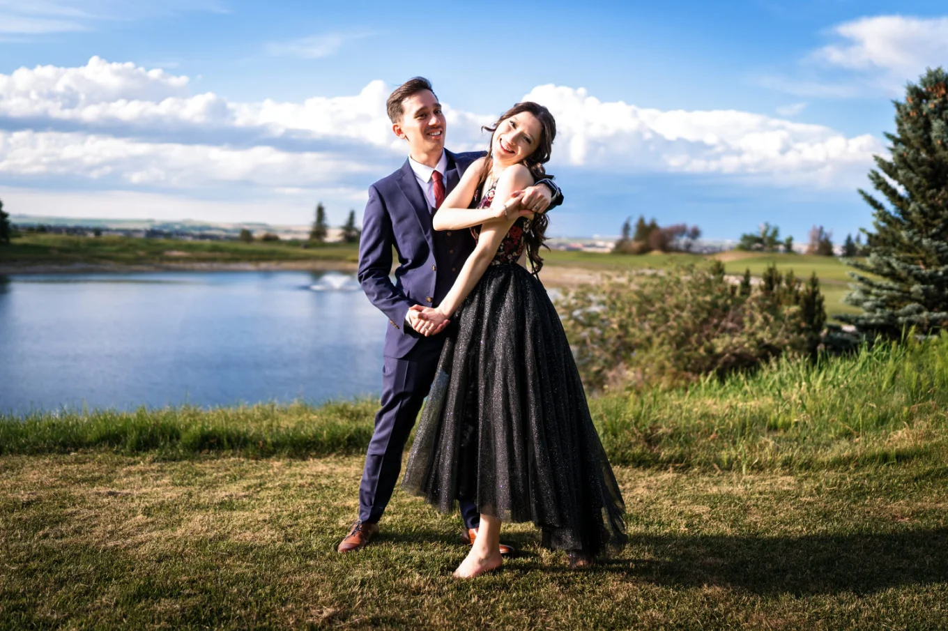 Bride and groom dance at the lake in Calgary.