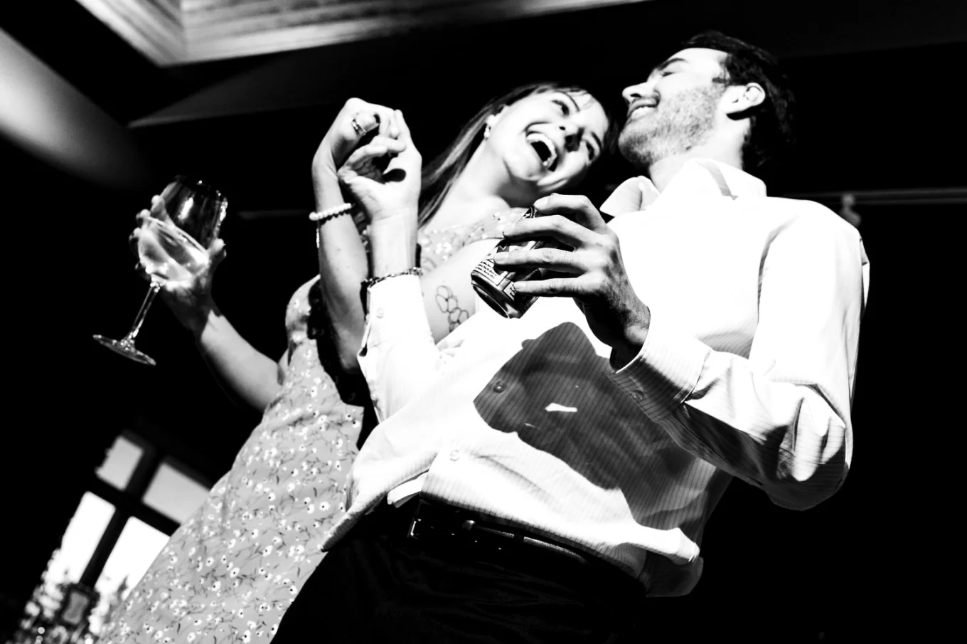 Couple holds their hands and laugh