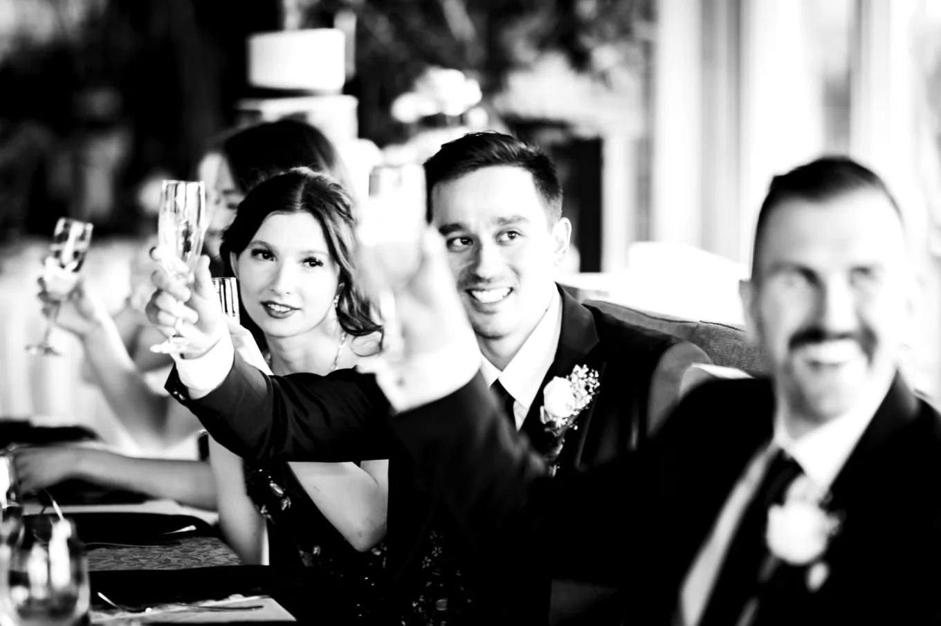 Bride and groom rise the glassed at the Calgary Wedding Reception.