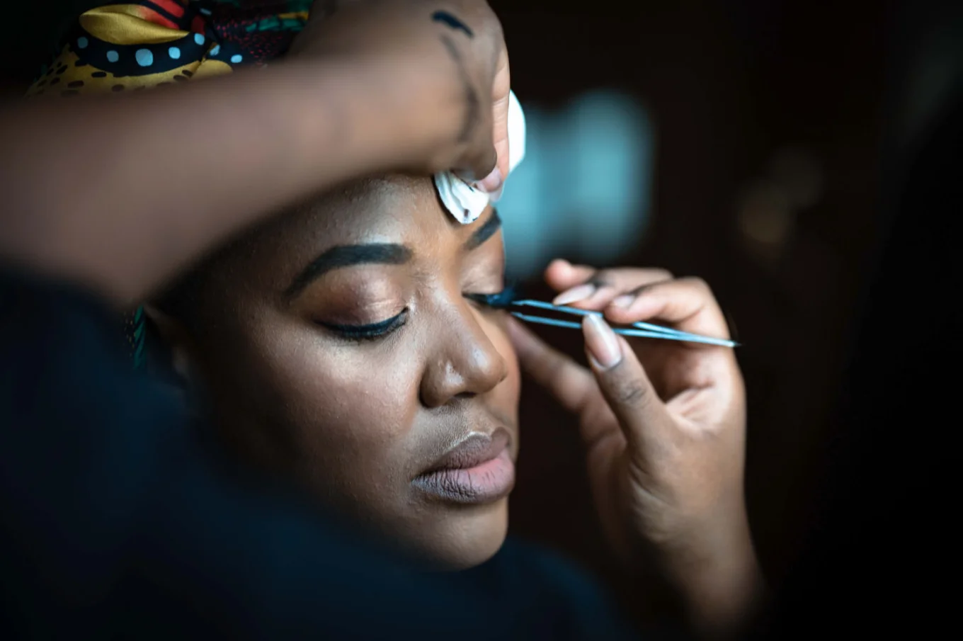 Bridesmaid getting make up done before Calgary Wedding.