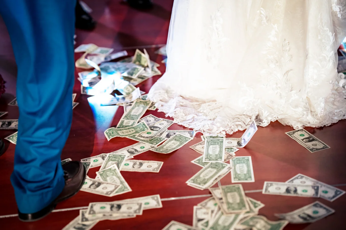 Money on the floor during money spraying at Nigerian wedding in Calgary.