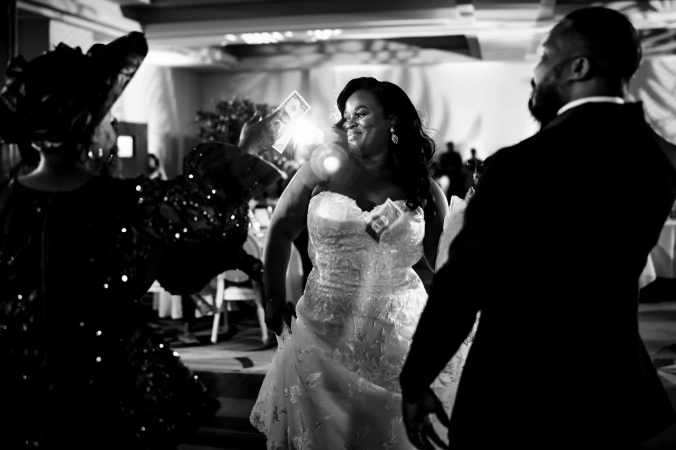 money spraying of the newlyweds at Nigerian wedding captured by Calgary Wedding Photographer.