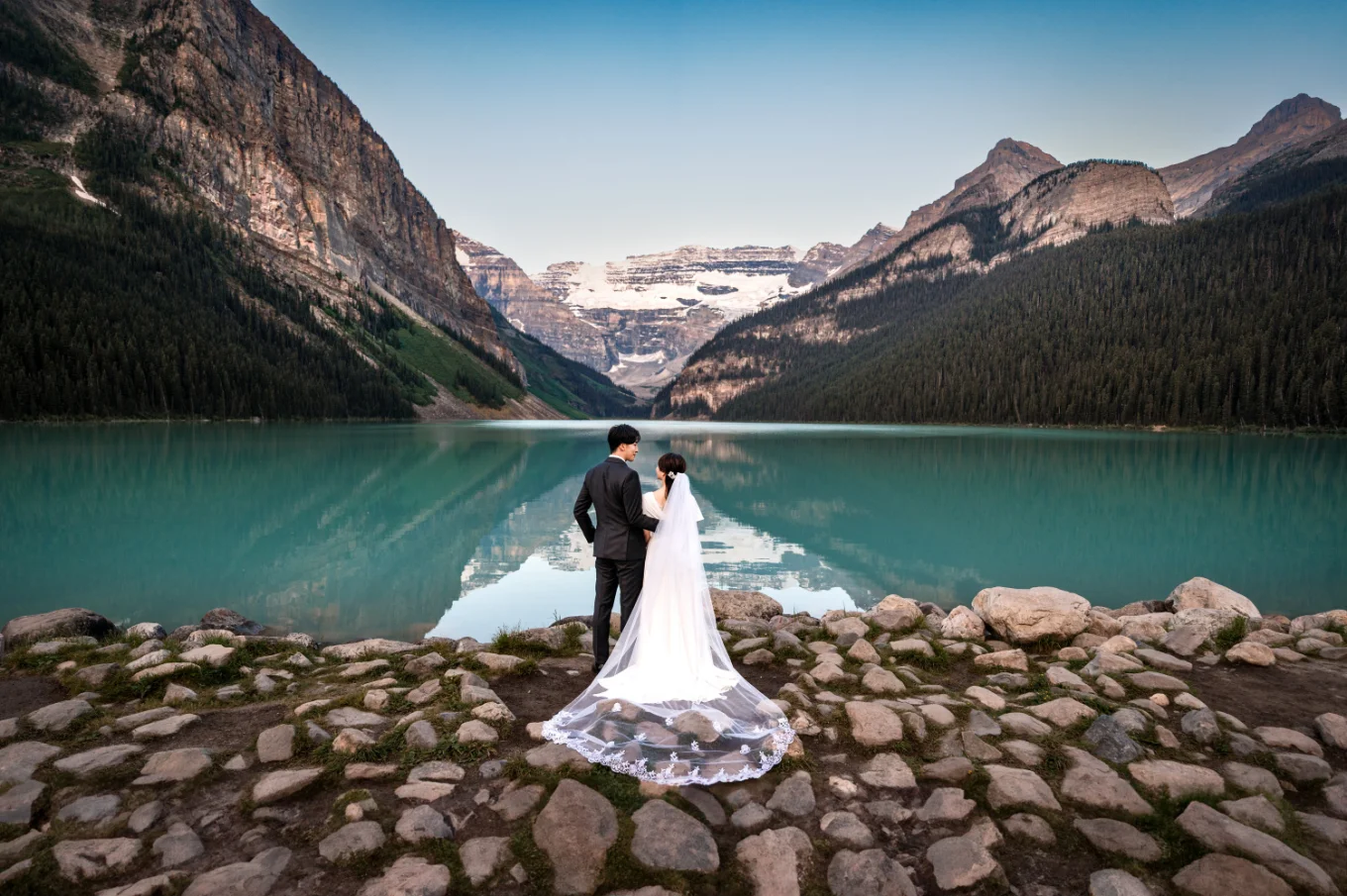 Wedding Portrait of the bride and groom from behind in the Canadian Rockies.