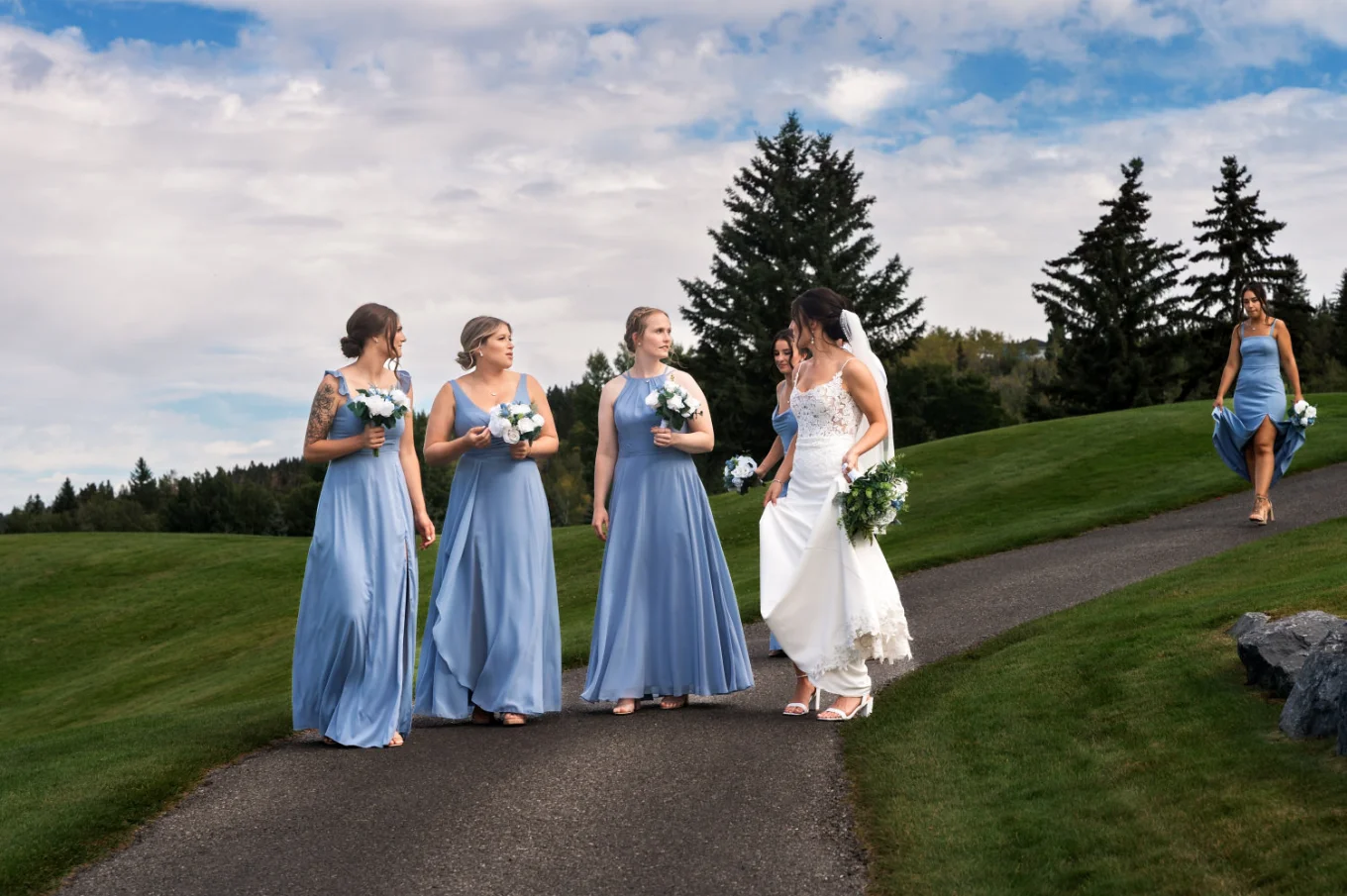 Bridal party walk and talk.
