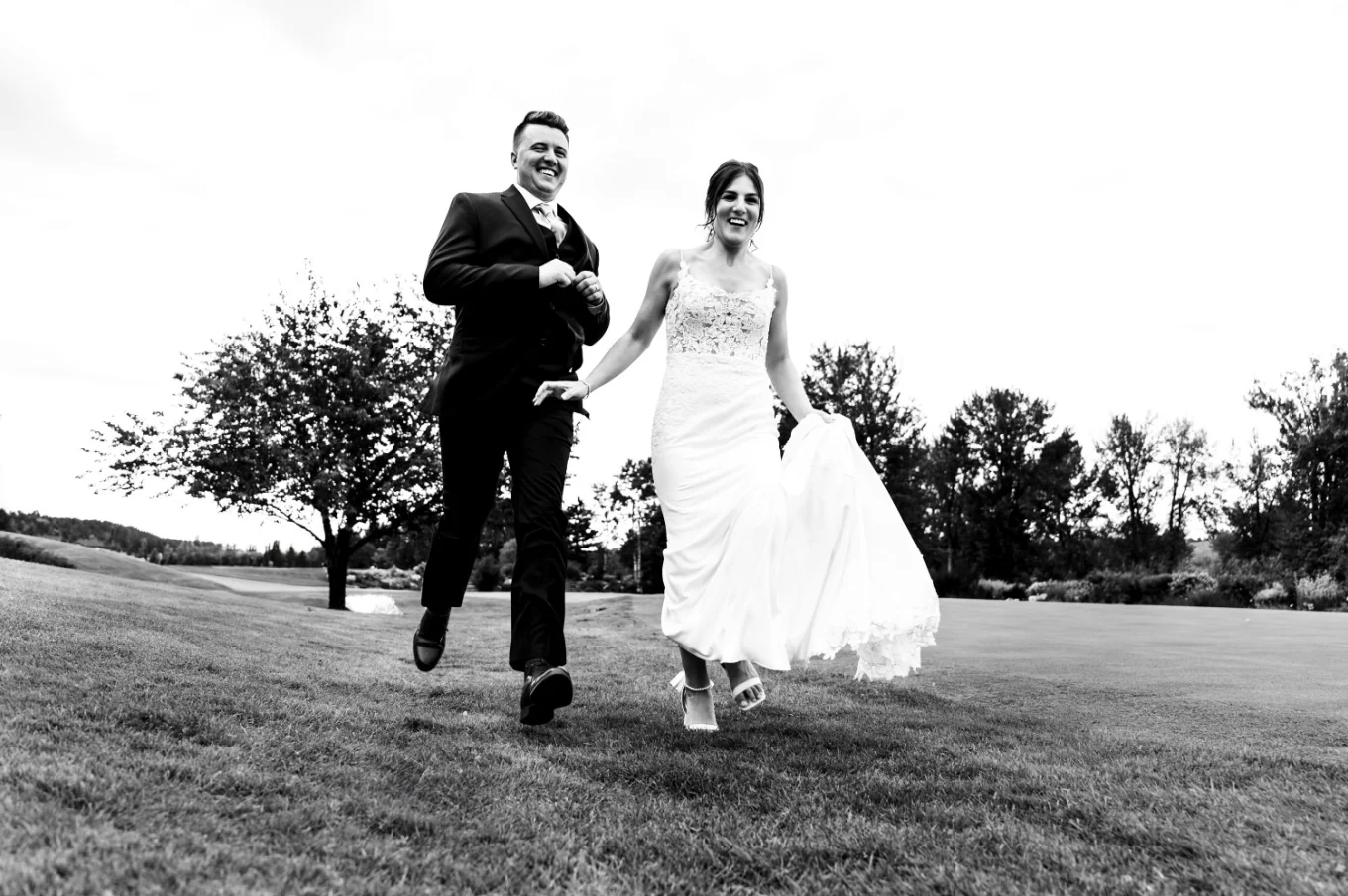 Bride and groom run away from the wedding reception in Calgary.