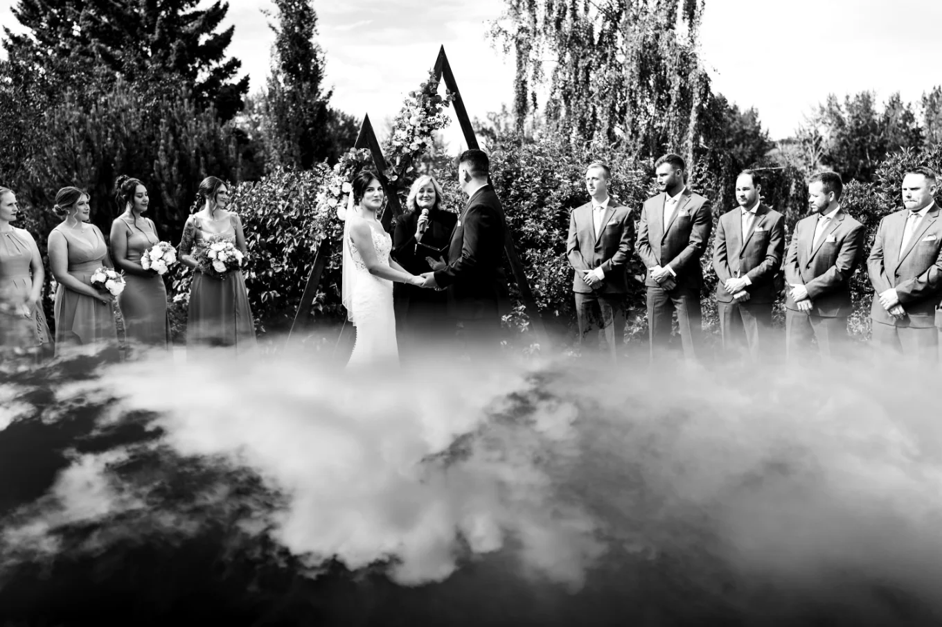 Calgary wedding ceremony in black and white with the reflection of the sky.