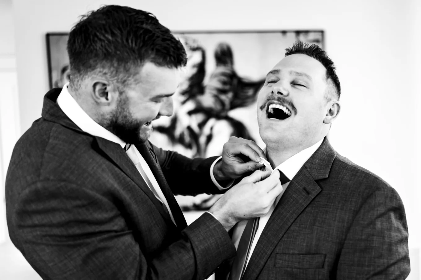 guys getting ready, dressing up and laugh before the Calgary wedding