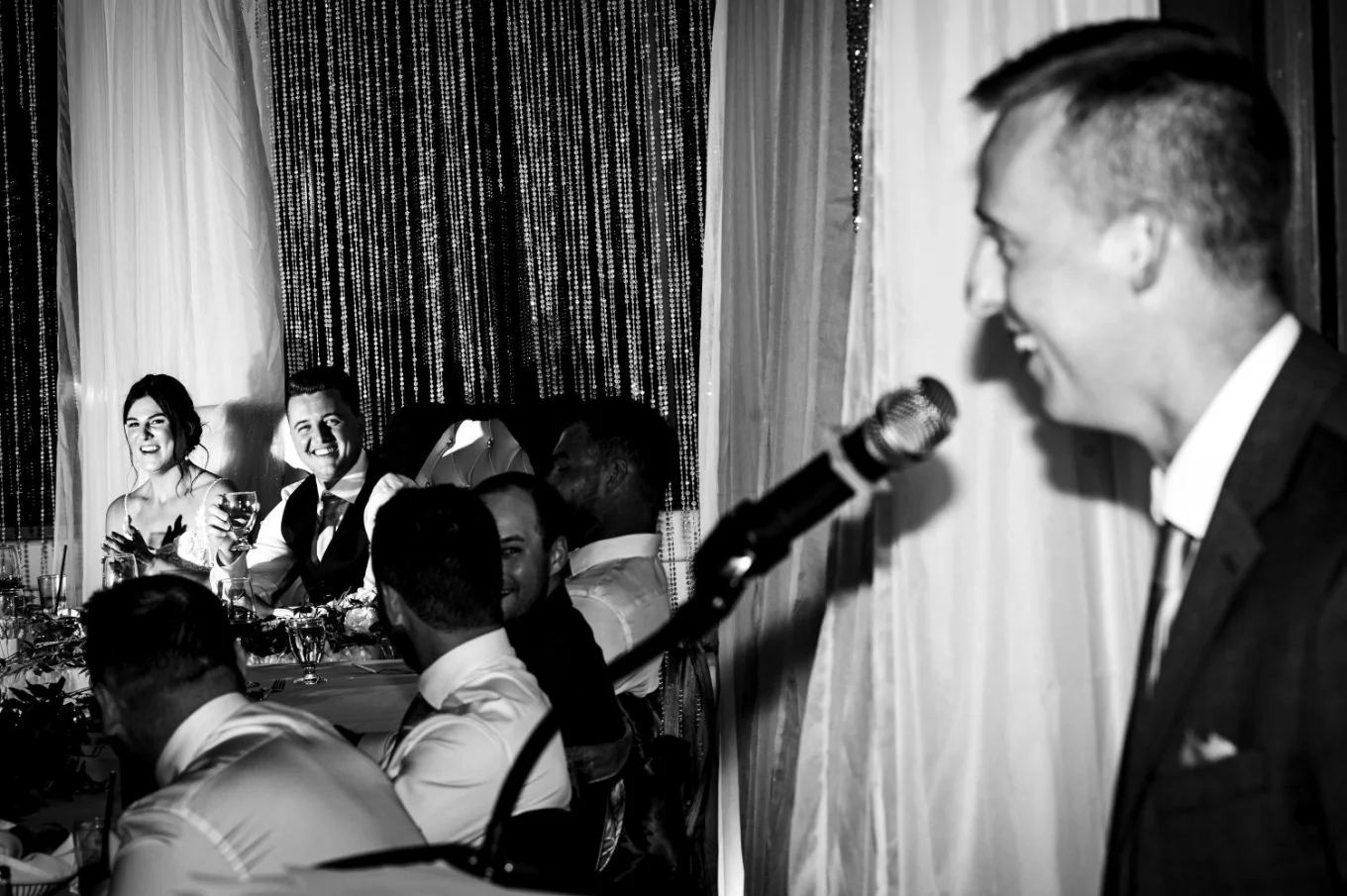 Fantastic photography in black and white of groomsman giving the speech.