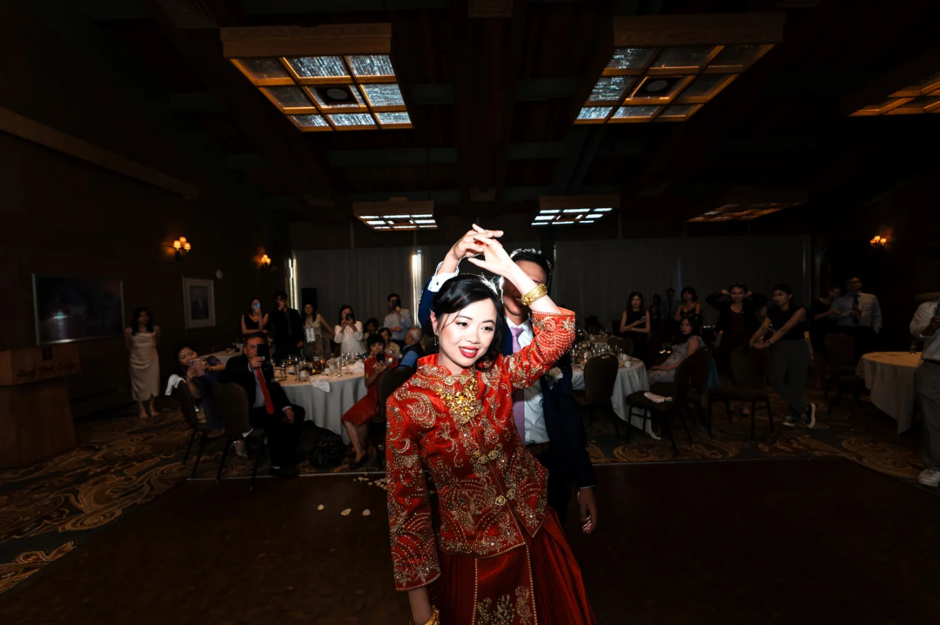 the groom spinning the bride during their first dance in Banff.