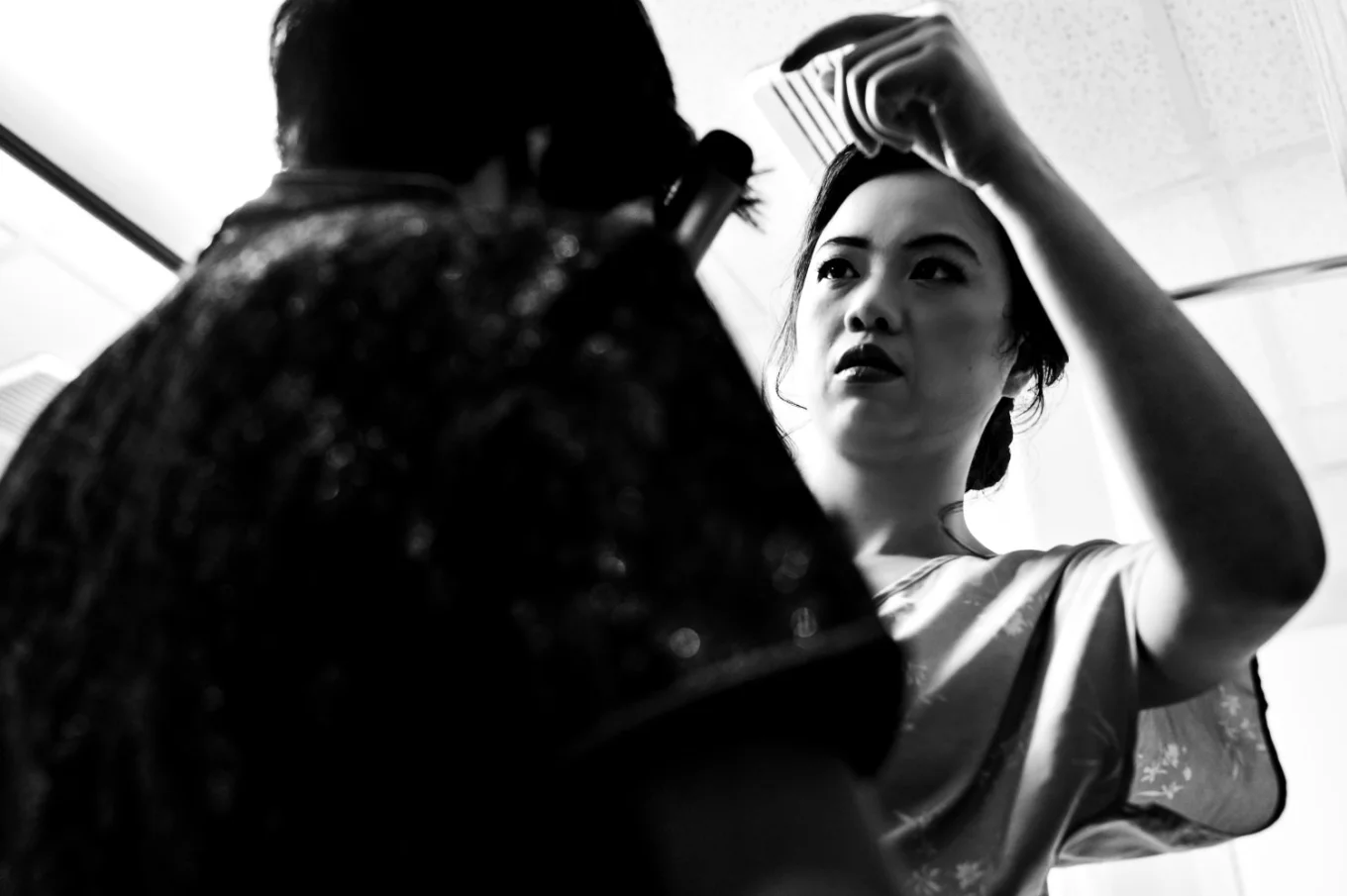 the bride fixes her mother's hair. Moment captured by banff wedding photographer.