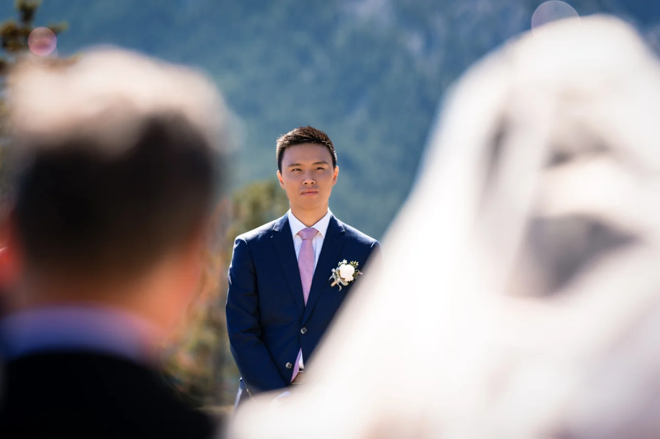 First look of the groom on the bride at the wedding ceremony in Banff.