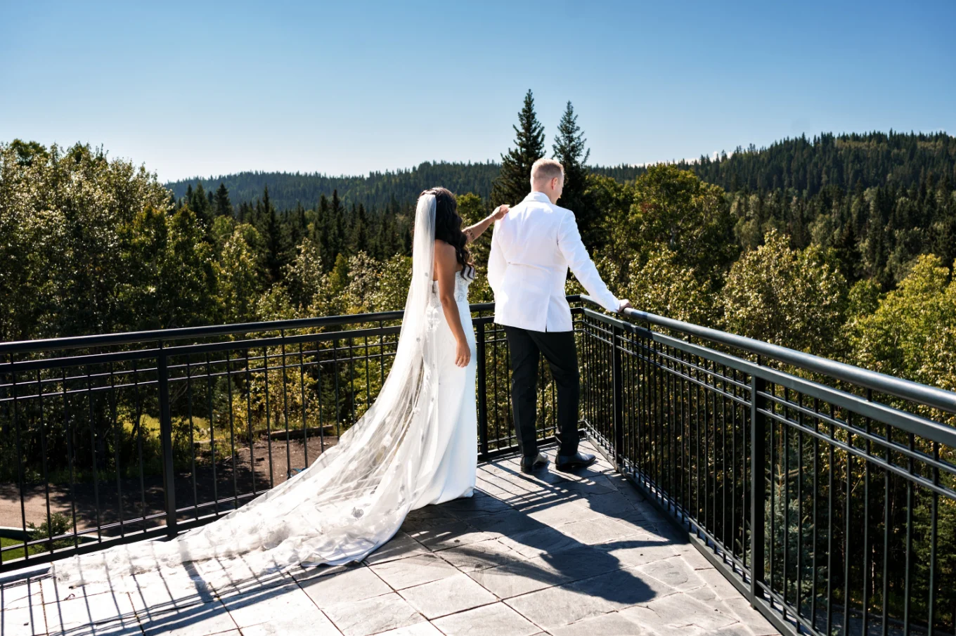 Calgary Wedding Photography of the bride standing behind the groom for the first look.