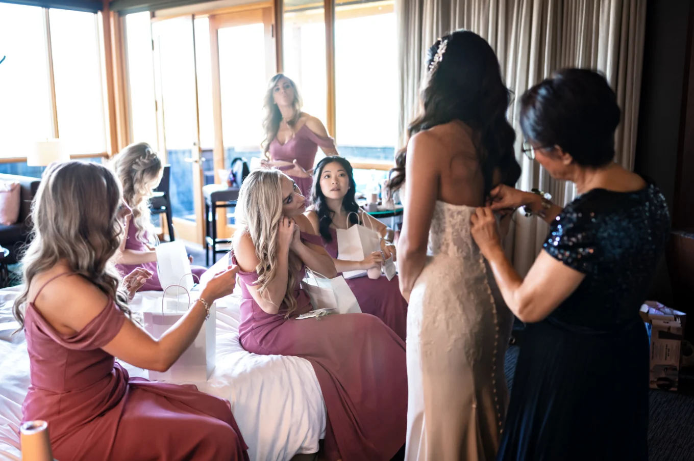 Bride and braid's maids get ready in the hotel room in Calgary