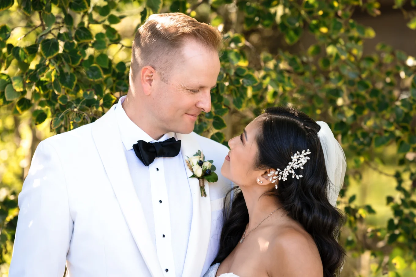 Bride and groom look at each other at the Calgary Wedding