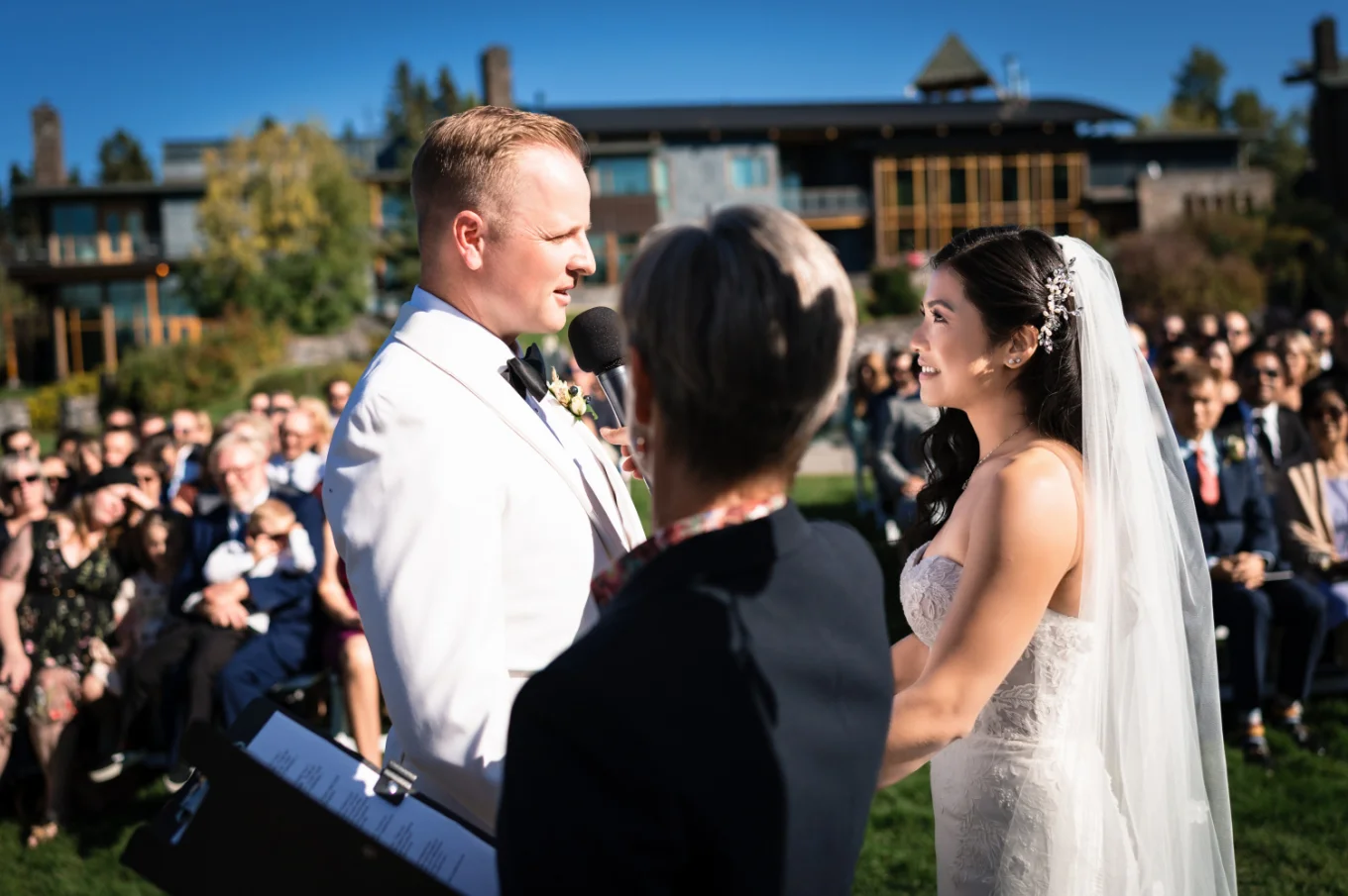 Calgary Wedding Photography of the bride and groom looking at each other during ceremony