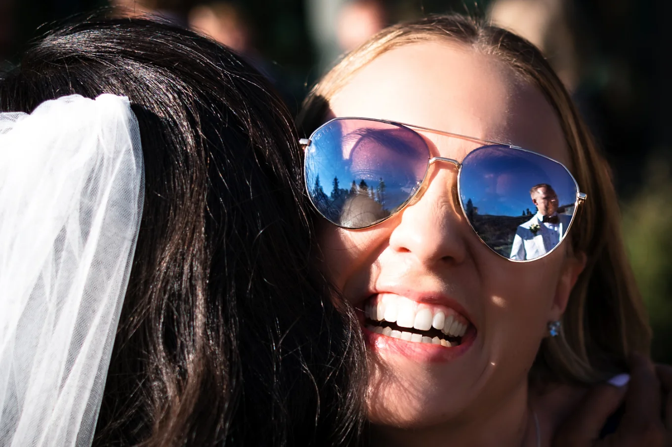 reflection of the groom in a sunglasses